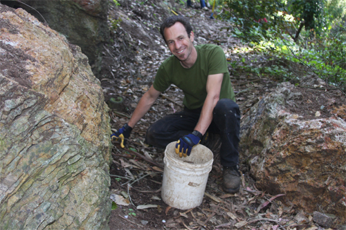 Remy Nelson collecting rocks on the Interior Greenbelt Trail on a Thursday evening